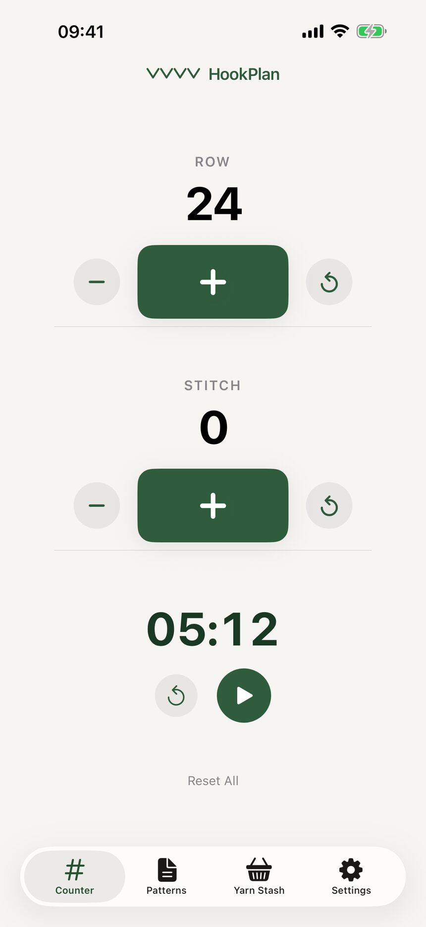 The minus button on the stitch counter being tapped to step the count back down.